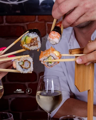 Sushi rolls with chopsticks